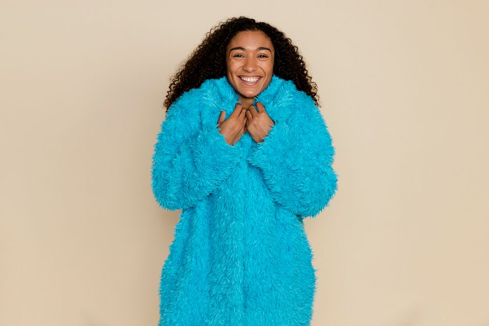 Funky woman wearing a warm blue teddy coat