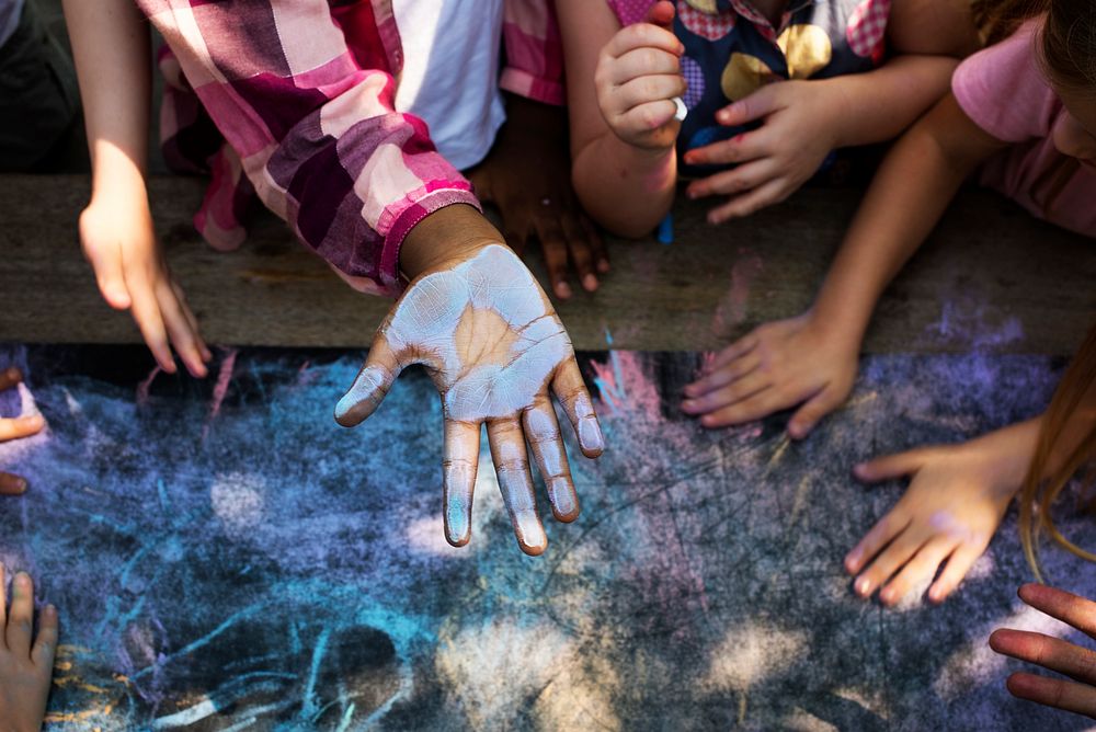 Blue chalk paint on kid hand