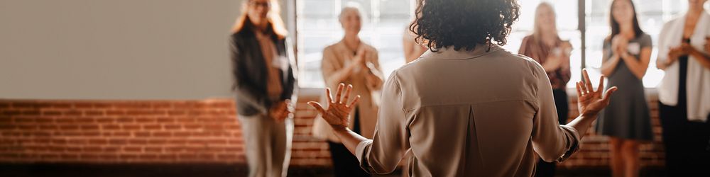 African american female empowering other colleagues in workplace