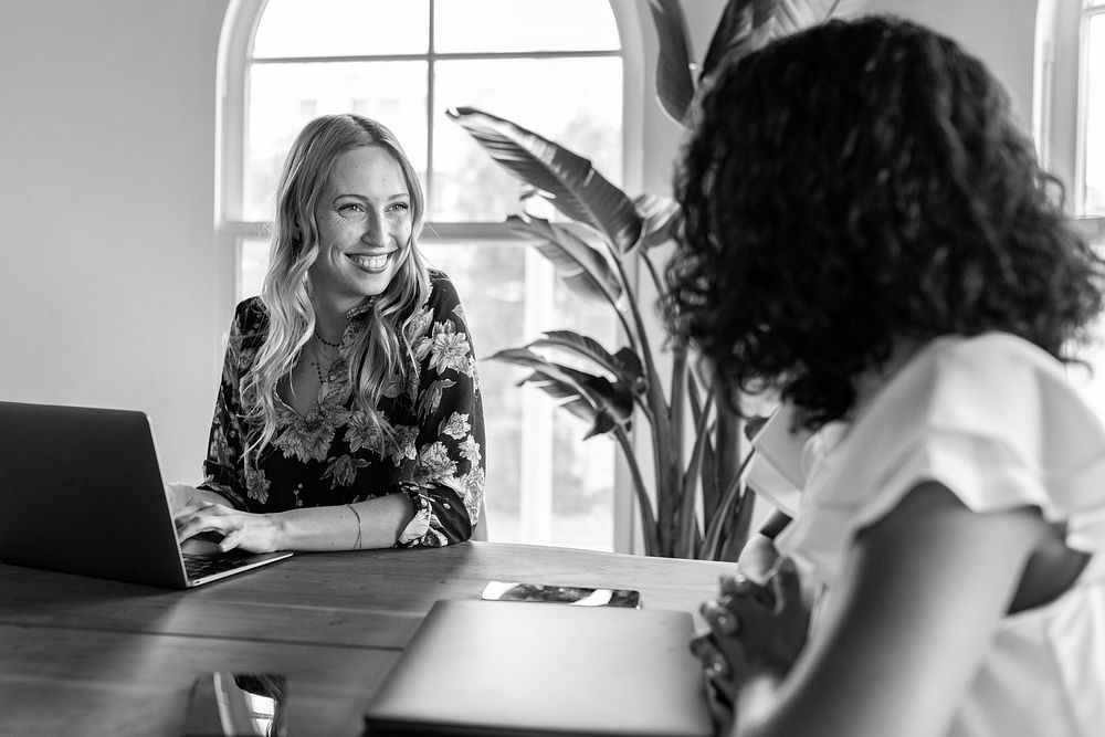 Businesswoman brainstorming in a meeting, black and white photo