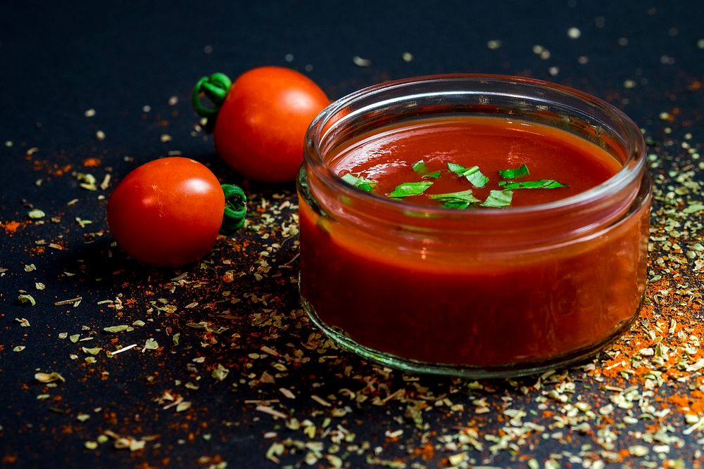 Bowl of fresh tomato sauce with basil and herbs. Original public domain image from Wikimedia Commons