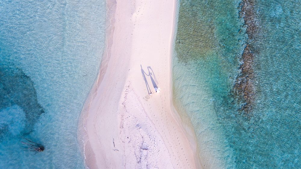 Beach drone view, wedding couple,Maldives. Original public domain image from Wikimedia Commons