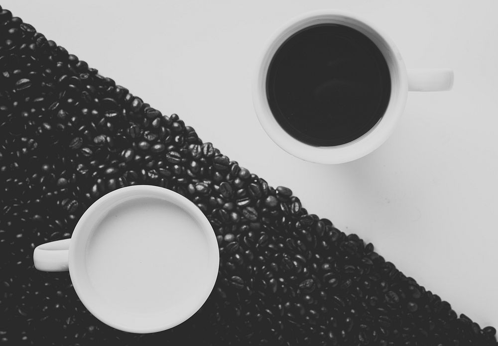 Black and white shot of ying yang arranged coffee and milk in separate cups. Original public domain image from Wikimedia…
