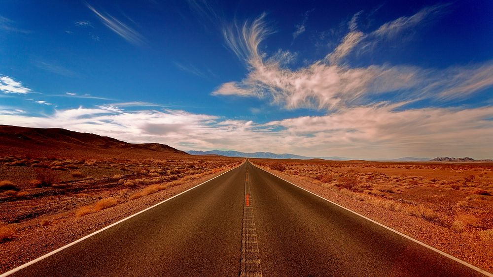 Desolate highway road through the desert. Original public domain image from Wikimedia Commons