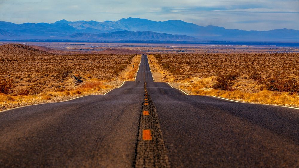 Empty road through desert. Original public domain image from Wikimedia Commons