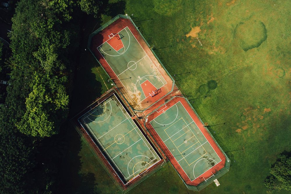 A drone shot of three sports fields in a park. Original public domain image from Wikimedia Commons
