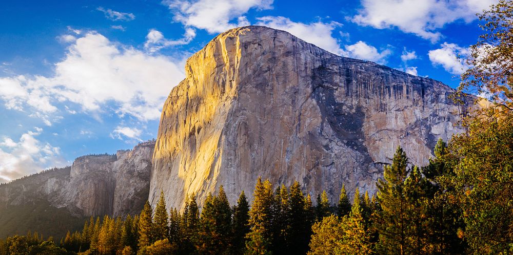 Sunlight illuminates the face of the El Capitan rock formation in Yosemite. Original public domain image from Wikimedia…