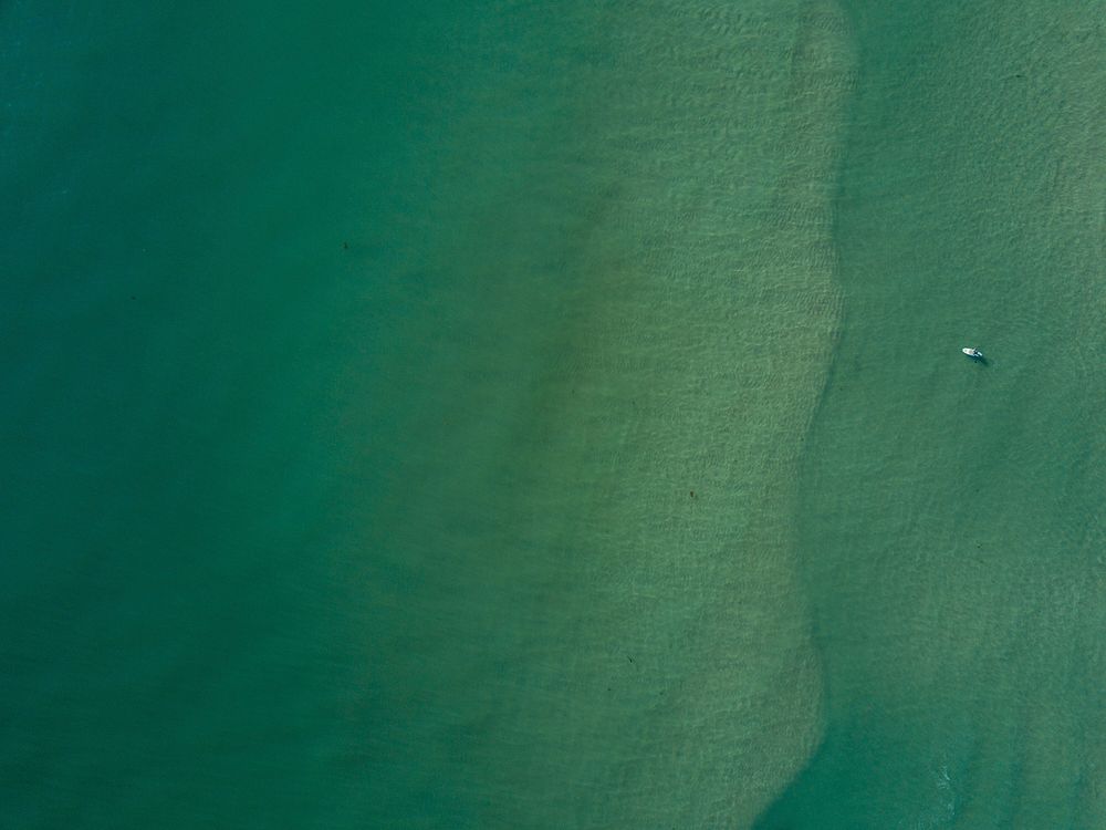 green sea, ocean, drone view, boat. Original public domain image from Wikimedia Commons