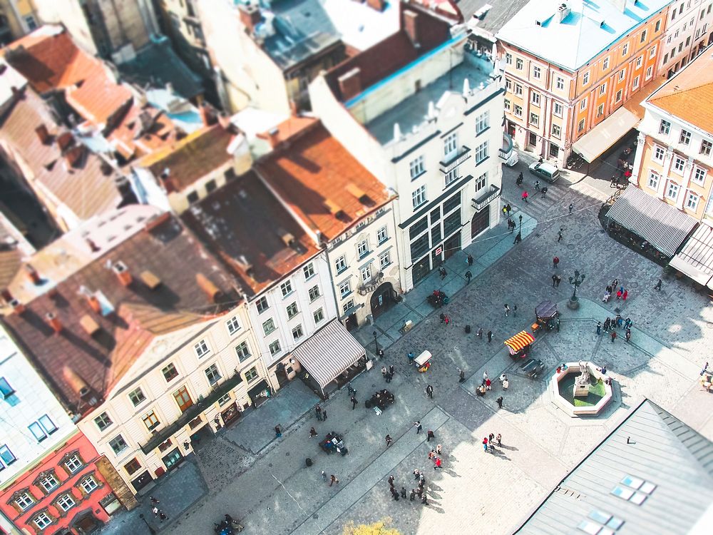 Tilt-shift aerial shot of busy courtyard and colorful buildings in Rynok Square. Original public domain image from Wikimedia…