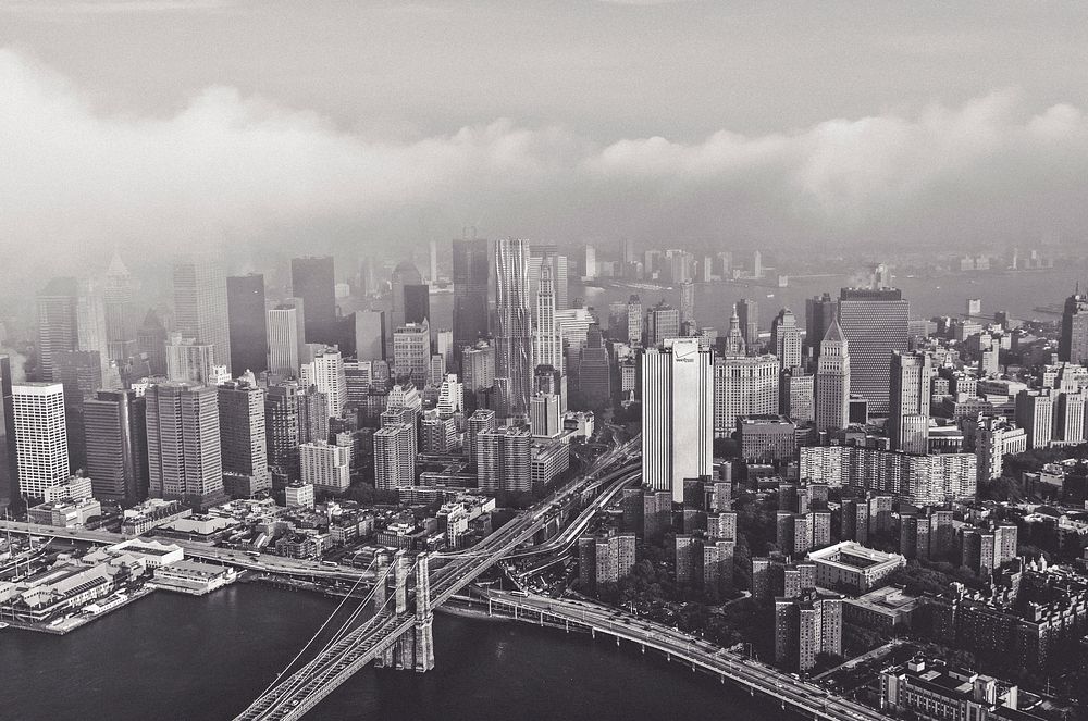 Black and white photo of fog surrounding the New York City skyline. Original public domain image from Wikimedia Commons