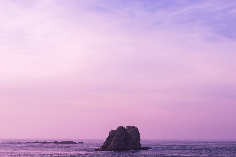 Gradiant purple sky ocean, rocks. Original public domain image from Wikimedia Commons