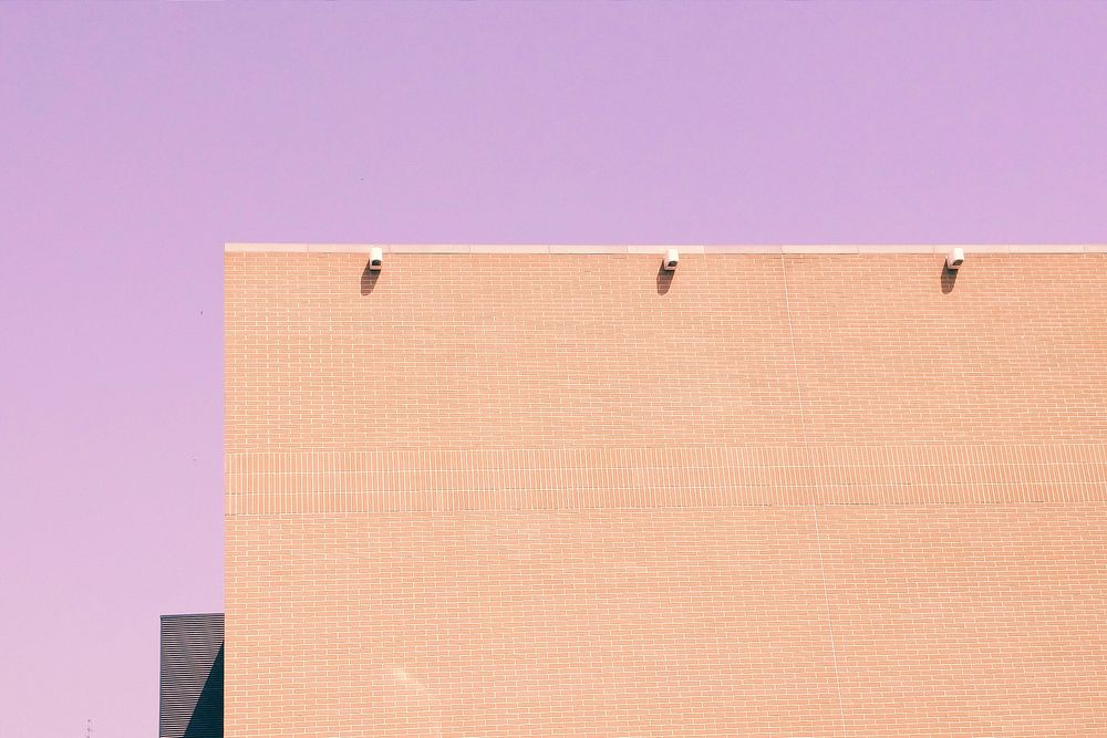 Beige building on purple background. Original public domain image from Wikimedia Commons
