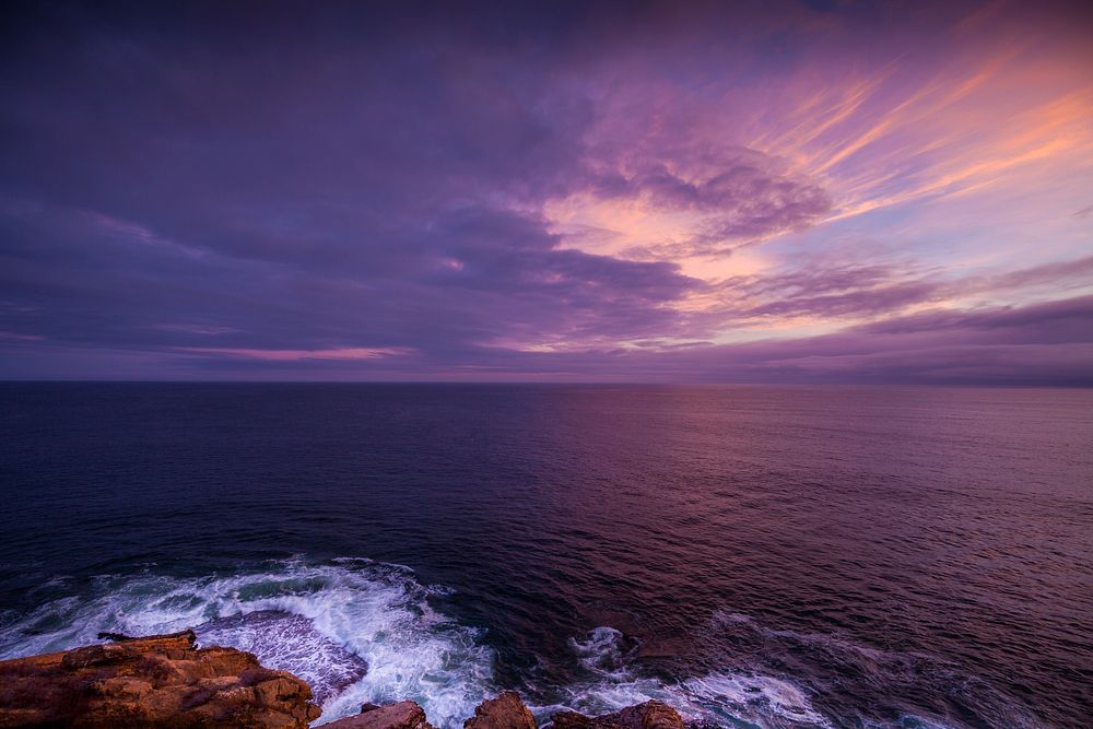 Purple sunset sky with waves. Original public domain image from Wikimedia Commons