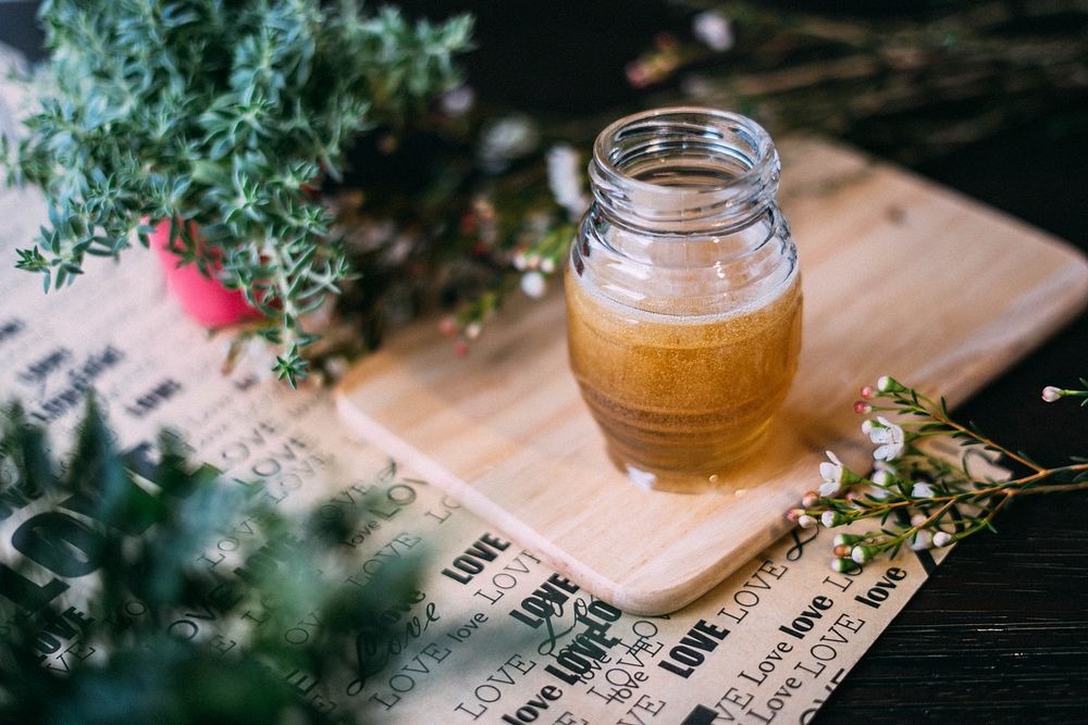 Honey jar with Christmas decoration. Original public domain image from Wikimedia Commons