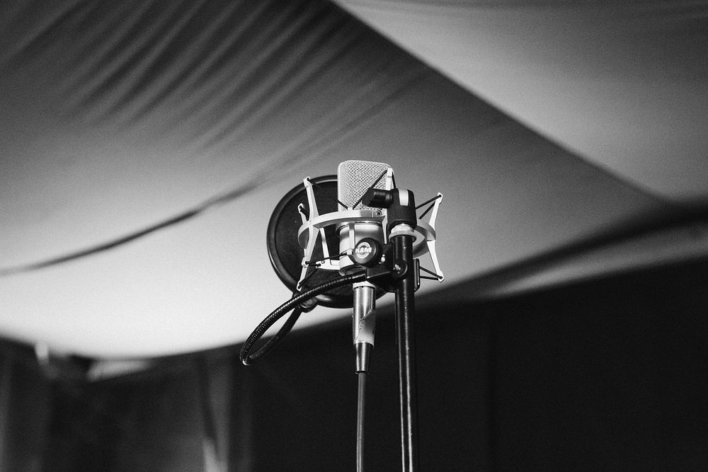 Black and white shot of microphone in recording studio in Saarbrücken. Original public domain image from Wikimedia Commons