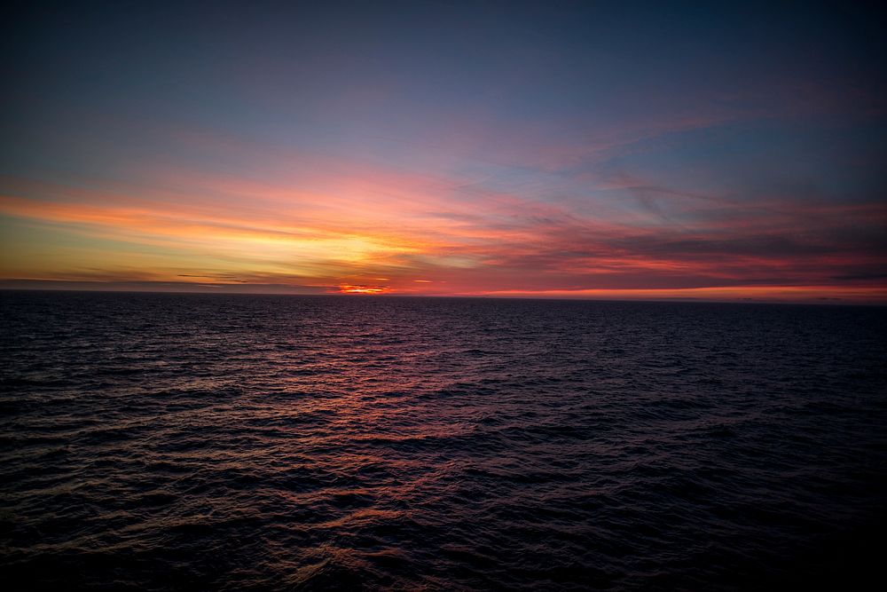 Horizontal sunset ocean view. Original public domain image from Wikimedia Commons
