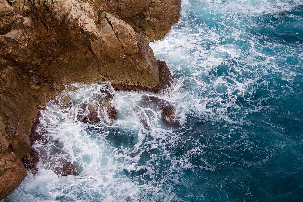 Cliff, ocean, water splashing, waves. Original public domain image from Wikimedia Commons