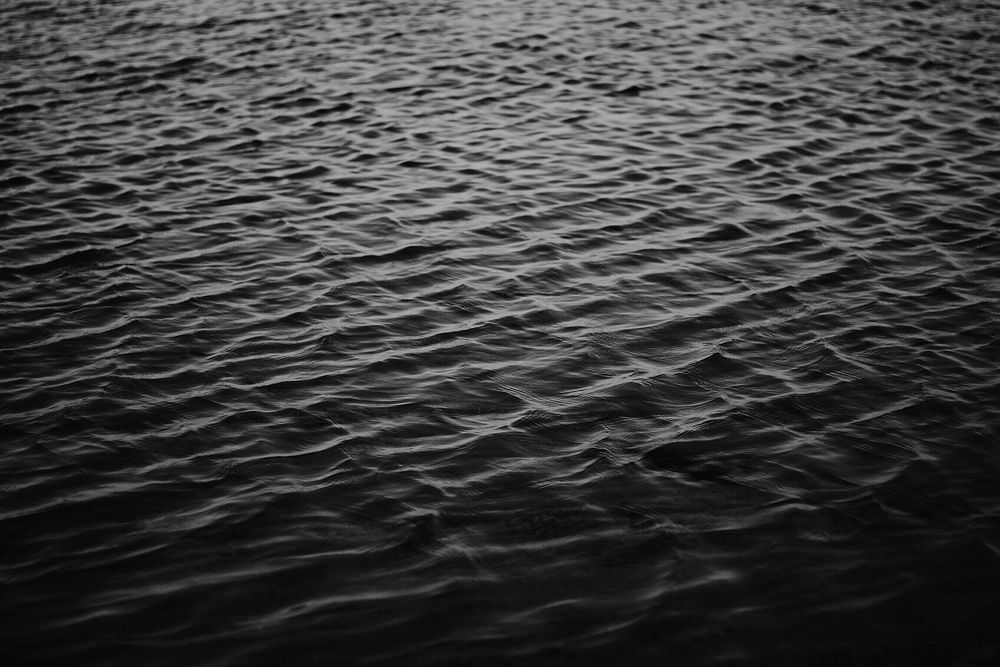 Black and white shot of water ripples in ocean. Original public domain image from Wikimedia Commons