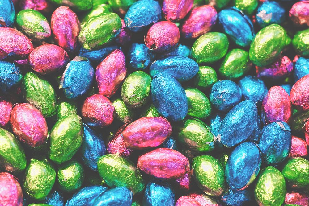Pile of chocolate easter egg candy in colorful foil wrappers. Original public domain image from Wikimedia Commons