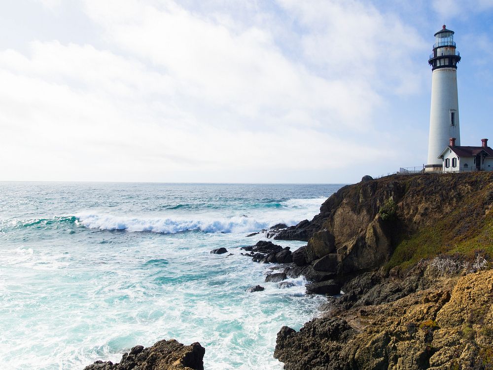 Crashing waves on a rocky coastline at a lighthouse in California. Original public domain image from Wikimedia Commons