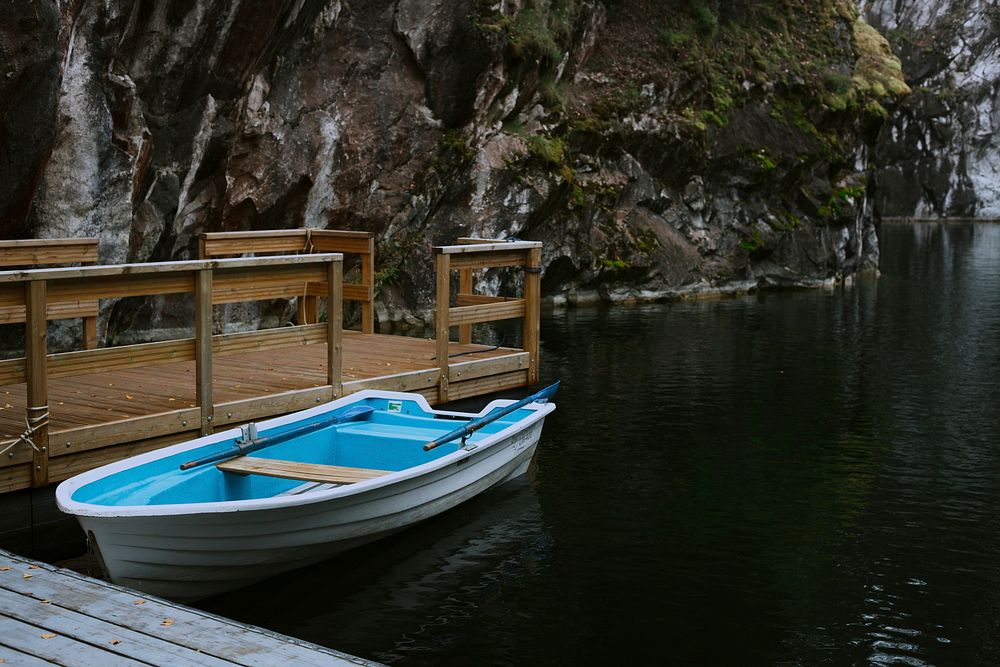 Row boat by a jetty. Original public domain image from Wikimedia Commons
