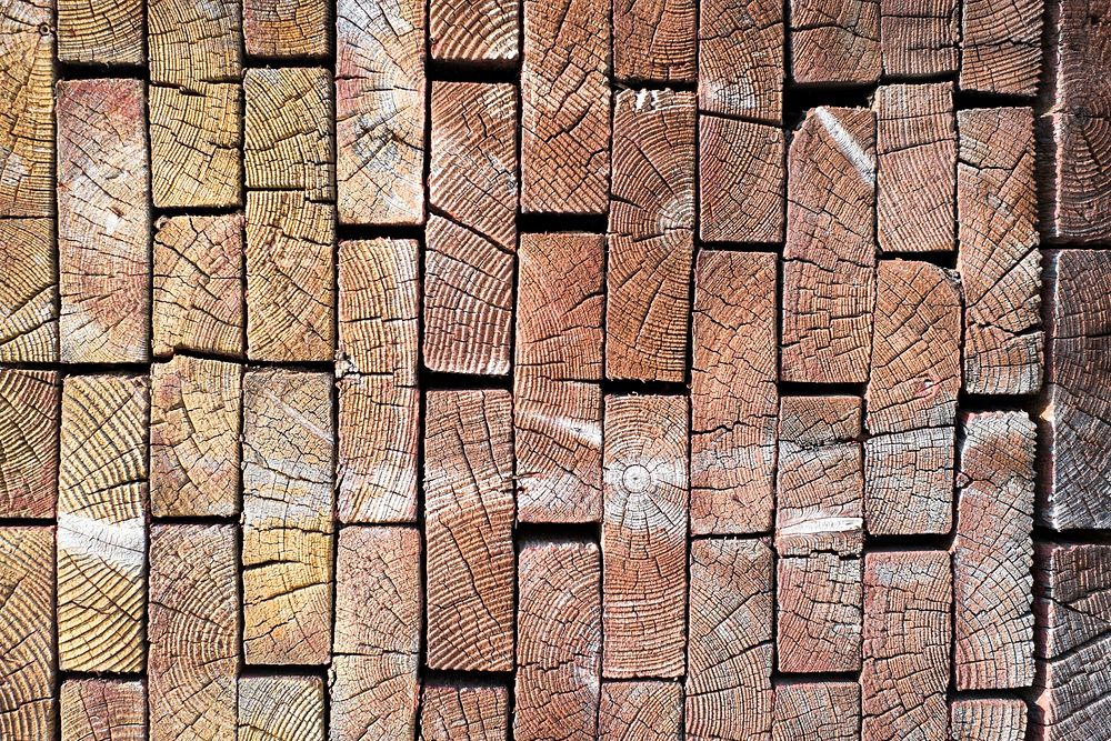 Wood shaped as blocks with textured pattern on them. Original public domain image from Wikimedia Commons