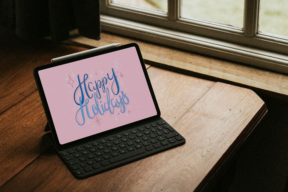 Happy holidays tablet mockup psd on a wooden table