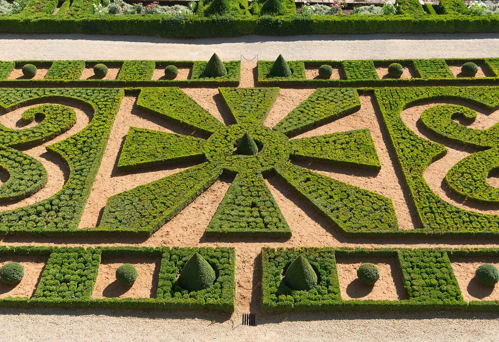 Part of the formal gardens of Château de Hautefort, Dordogne, France. Original public domain image from Wikimedia Commons