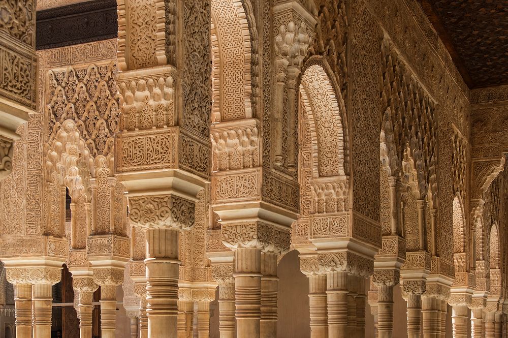 Columns and arches in the Patio de los Leones, Alhambra, Granada, Andalusia, Spain. Original public domain image from…