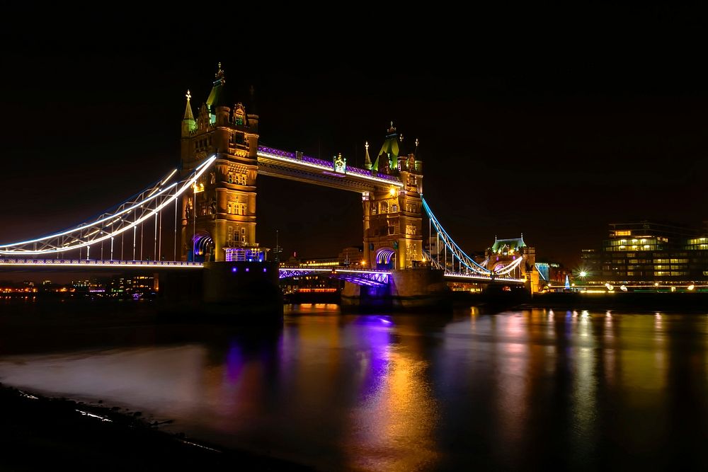 Tower Bridge of London at night. Original public domain image from Wikimedia Commons