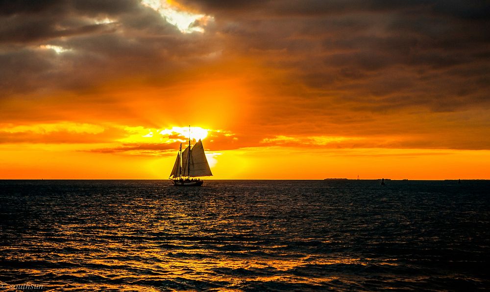 A lone sailing boat near Key West, Florida. Original public domain image from Wikimedia Commons