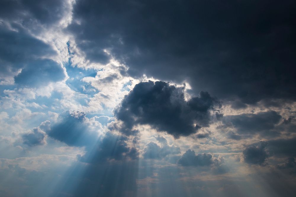 Sunlight beaming through the clouds. Original public domain image from Wikimedia Commons