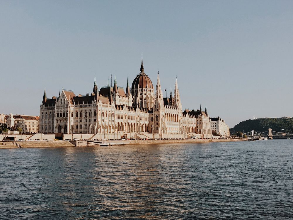 White and Brown Building Beside Body of Water. Original public domain image from Wikimedia Commons