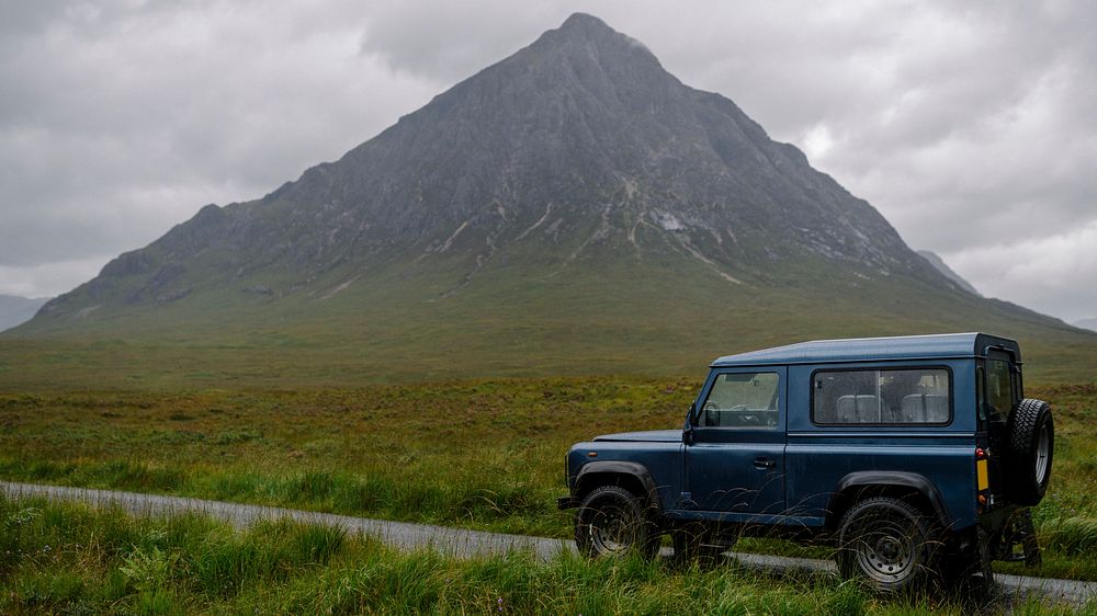 Adventure desktop wallpaper background, SUV on a road through the Scottish Highlands, Scotland