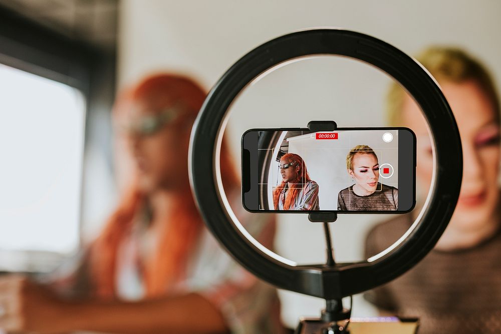 Drag queen beauty blogger recording a makeup tutorial video