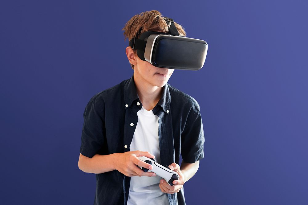 Young boy playing VR game, entertainment technology