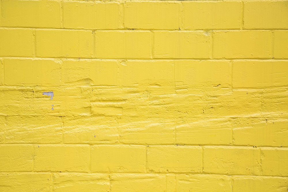 Yellow brick wall background, free public domain CC0 image.