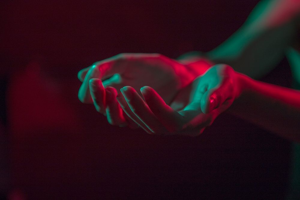 Begging hands in the dark