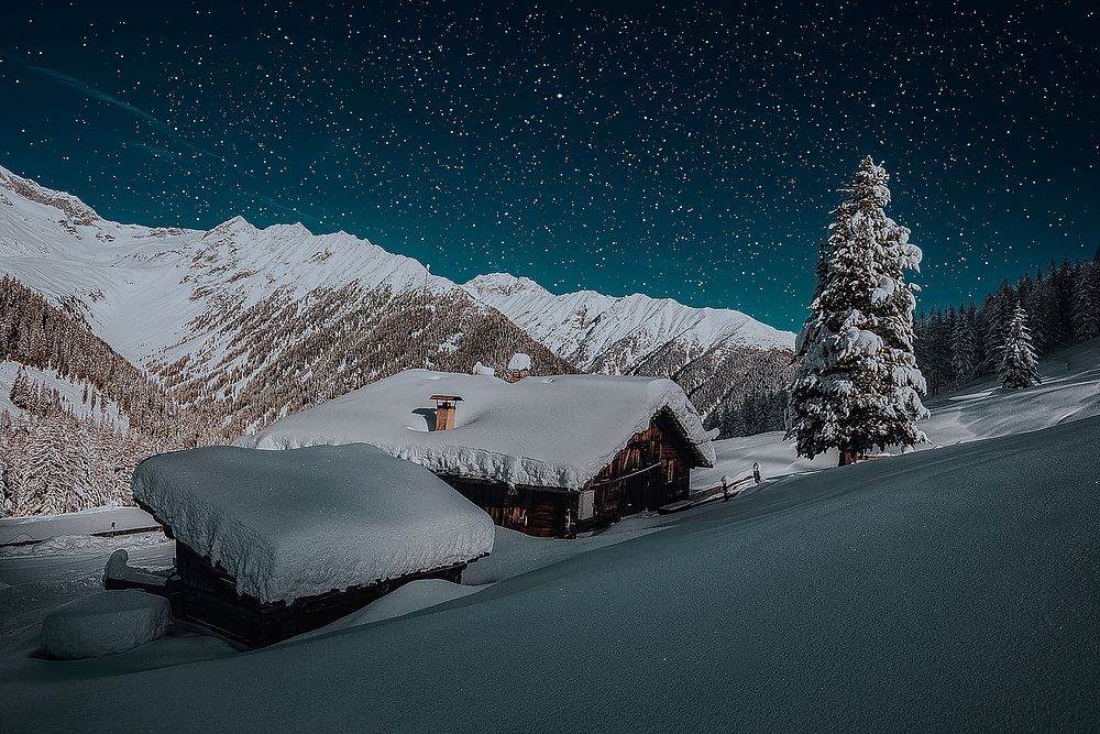 Starry skies and zillertal alps covered in snow