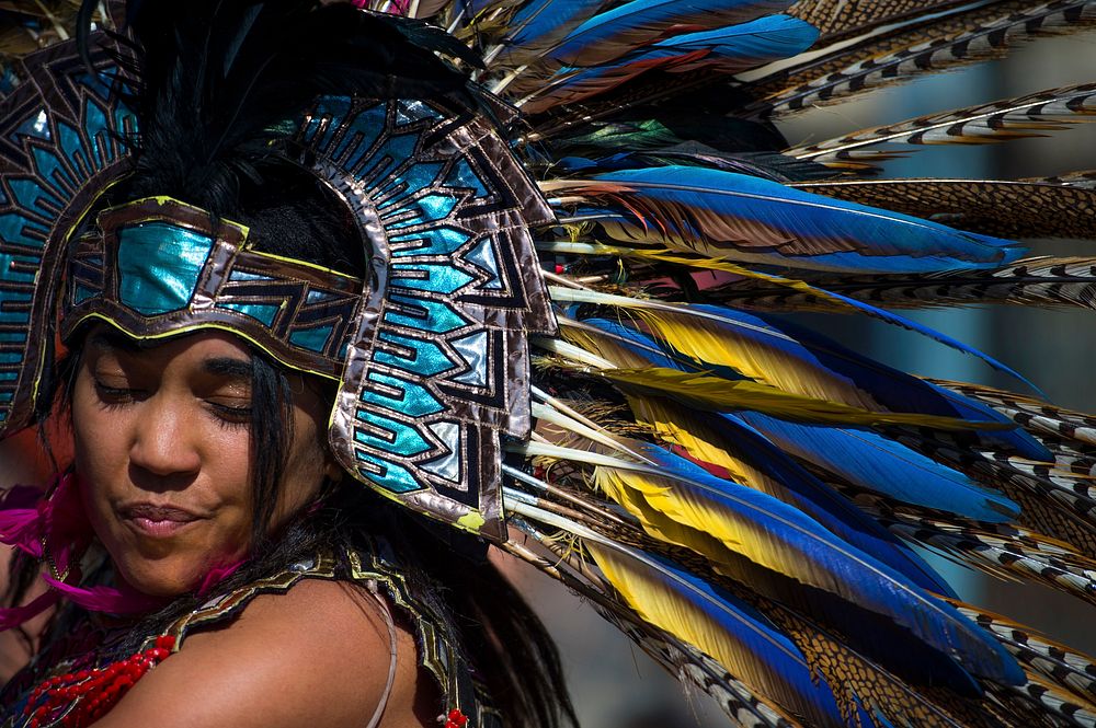An Aztec heritage dancer wears traditional regalia for a performance during the annual Latino Heritage Festival in Des…
