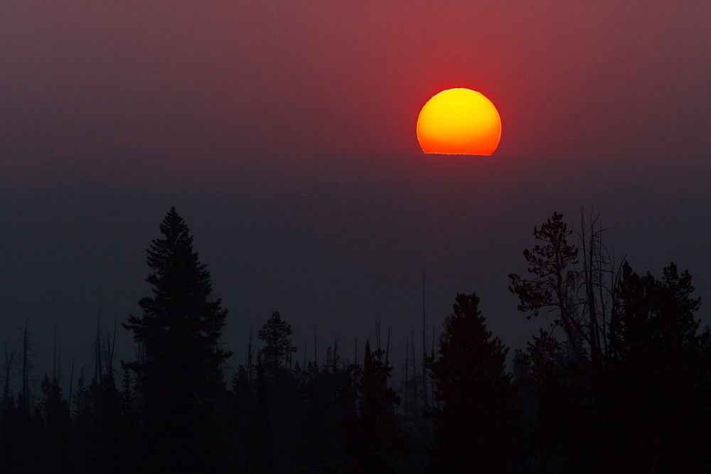 Smoke colors the sunrise over the Beartooth Plateau. Original public domain image from Flickr