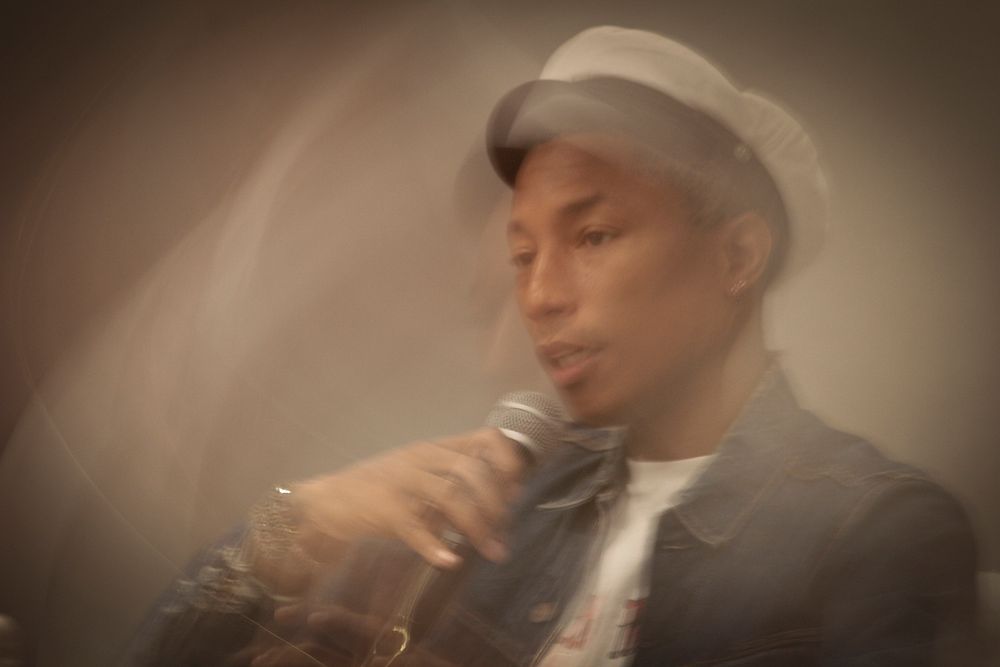 Pharrell Williams talking in Innovation Discussion, South Africa, 24 September 2015. Original public domain image from Flickr