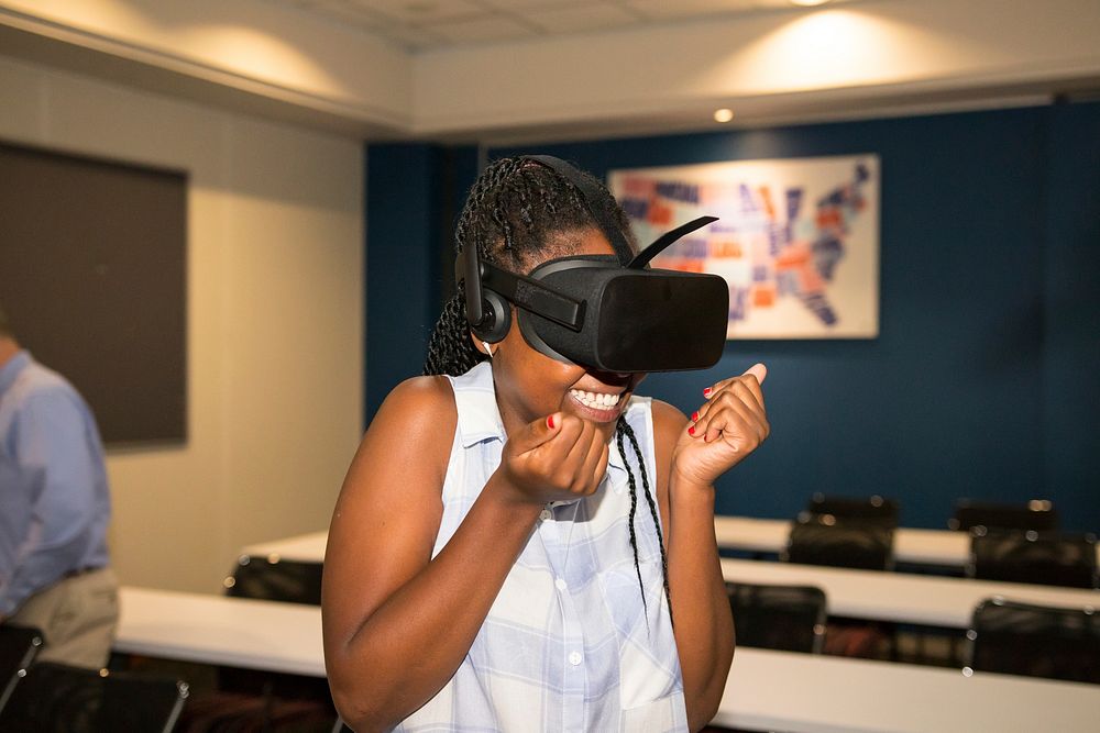 Black woman experiencing VR, South Africa, 4 April 2018. Original public domain image from Flickr