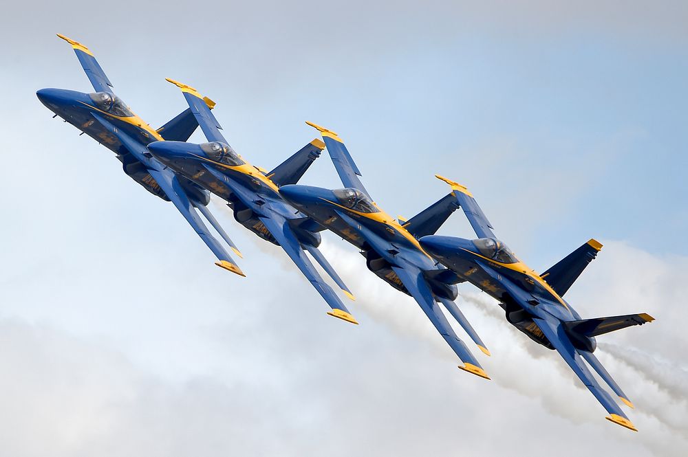 The U.S. Navy Blue Angels perform precision formation flying and aerobatics during the Arctic Thunder Open House at Joint…