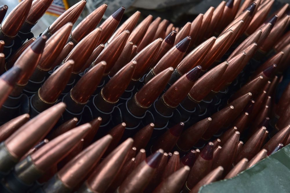 Machine gun ammunition is seen stacked at a supply point as Soldiers assigned to the 95th Chemical Company, “Arctic…