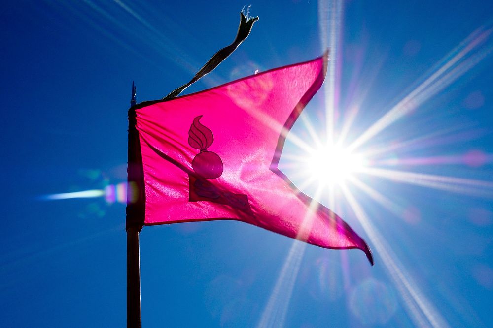 A company guidon waves in the breeze as Soldiers assigned to the 98th Support Maintenance Company. Original public domain…