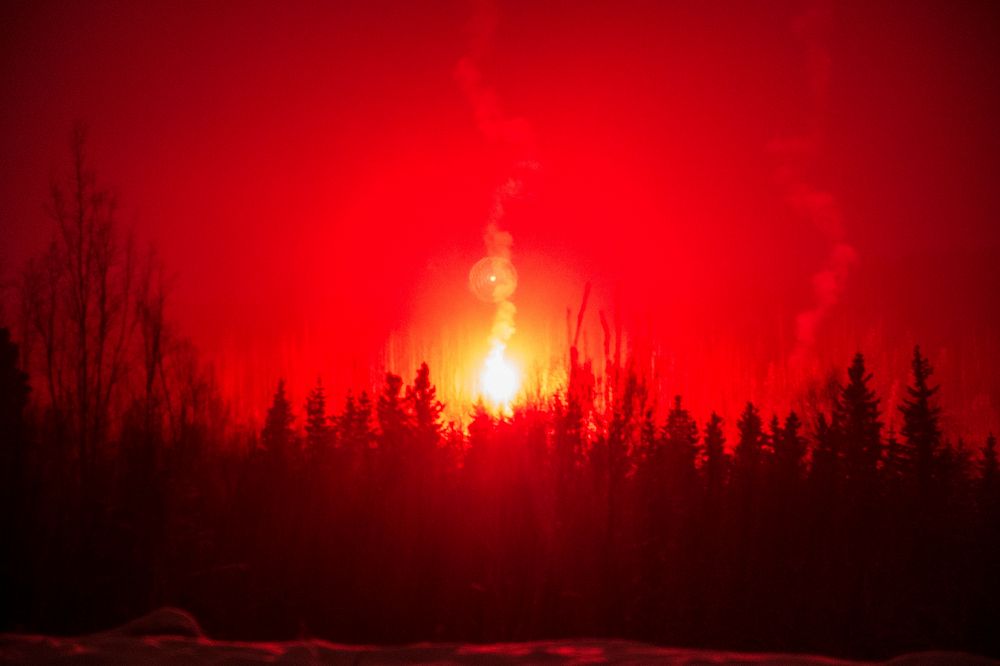 A flare illuminates a distant wood-line as Soldiers assigned to 1st Battalion, 5th Infantry Regiment, 1st Stryker Brigade…