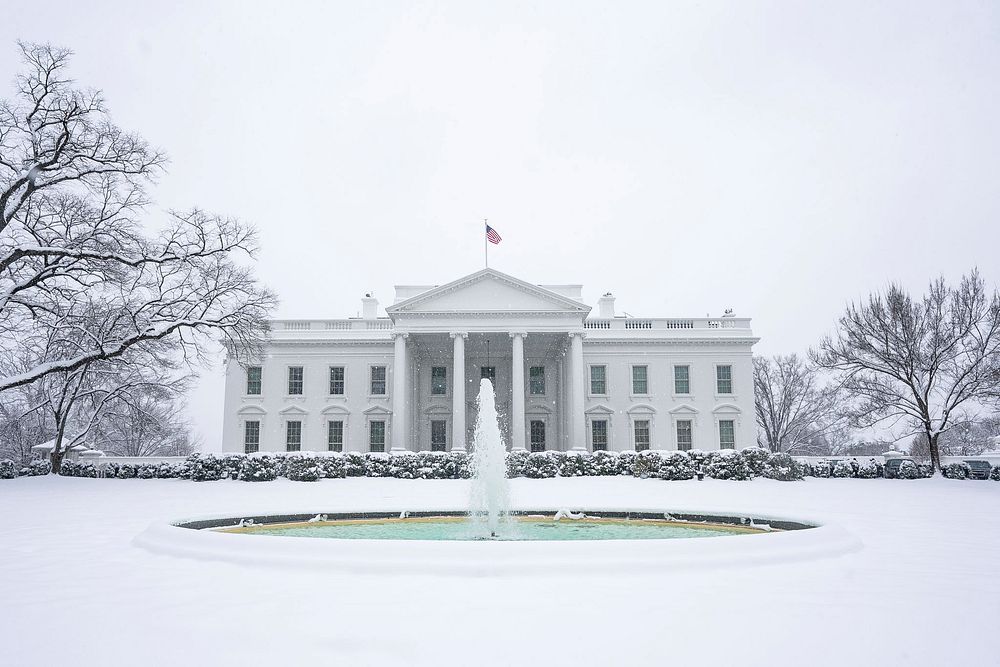 The White House grounds covered in snow. Original public domain image from Flickr