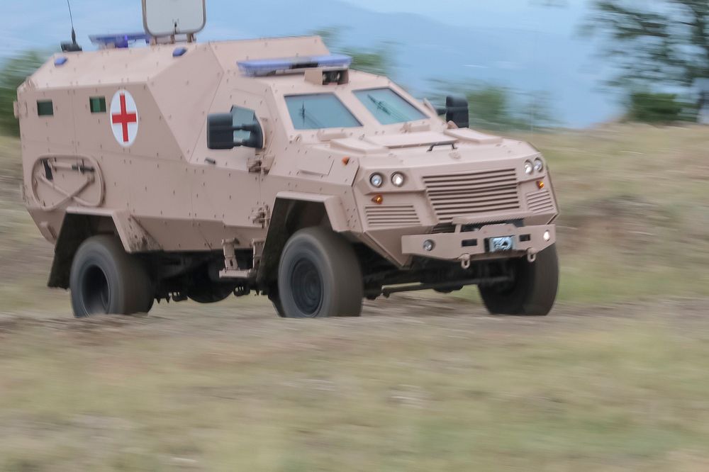 A Georgian Armed Forces medical ambulance races to the ambulance exchange point. Original public domain image from Flickr