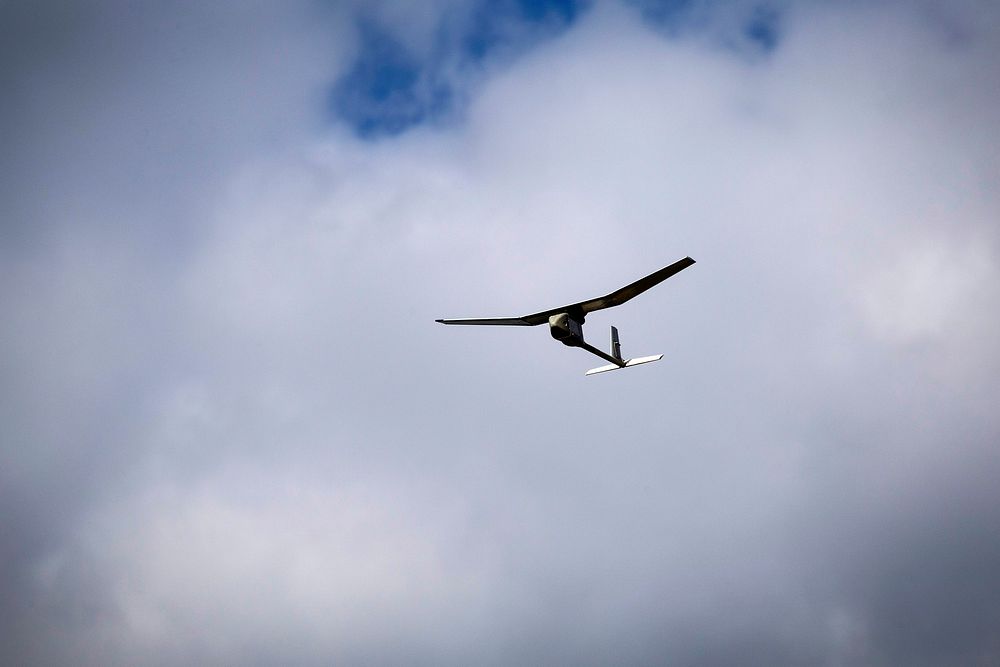 A U.S. Army RQ-11 Raven B, a small unmanned aerial system, flies over range 86 during the field training portion of the 1st…